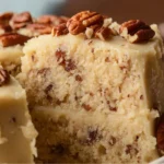 Delicious Butter Pecan Cake topped with pecans and creamy frosting