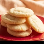 Chewy sugar cookies freshly baked with a golden edge and soft center