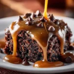 Chocolate Caramel Dump Cake topped with chocolate and caramel drizzles.