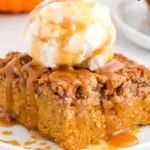 Delicious pumpkin spice dump cake served in a cozy autumn setting