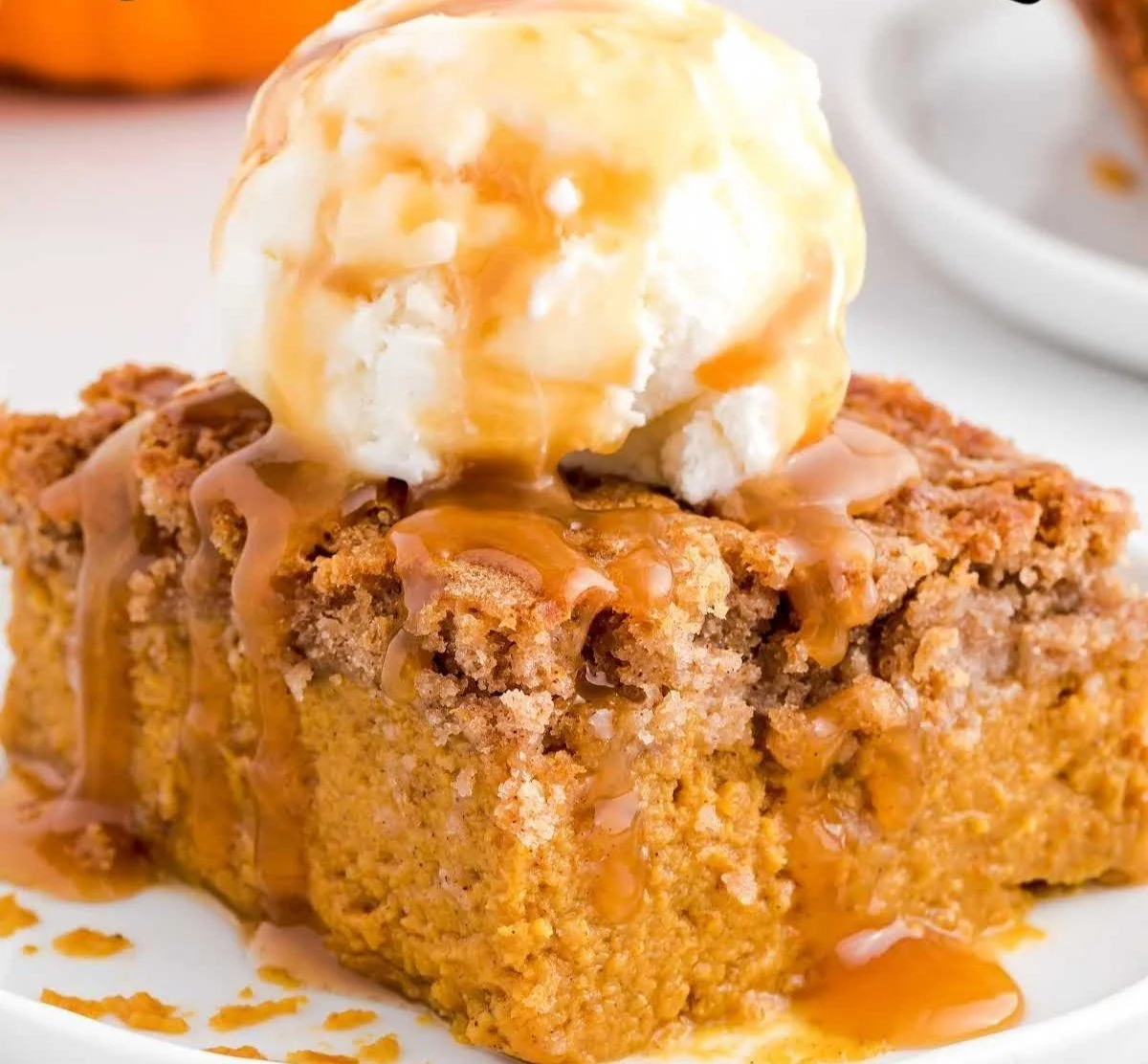 Delicious pumpkin spice dump cake served in a cozy autumn setting