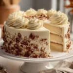 Sliced quick Italian Cream Cake showcasing layers and creamy topping.