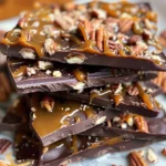 Delicious homemade chocolate caramel bark topped with nuts and sea salt