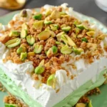 Delicious homemade pistachio pudding dessert in a bowl with nuts on top