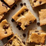 Delicious chocolate chip cookie bars with melted chocolate chips and golden brown edges