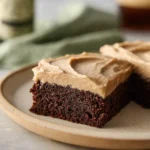 Delicious Guinness brownies topped with rich frosting on a plate