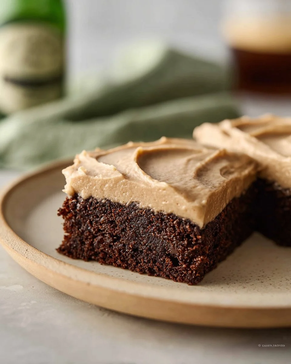 Delicious Guinness brownies topped with rich frosting on a plate