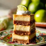 Key Lime Cheesecake Bars with a creamy filling and lime zest on top