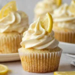 Delicious lemon cupcakes topped with creamy frosting and lemon zest