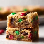 Delicious M&M chocolate chip bars dessert with chocolate chips and colorful M&Ms