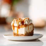 Delicious pumpkin cheesecake with a gingersnap crust on a festive table.
