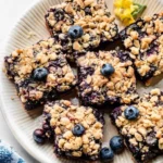 Delicious blueberry pie bars with a crumbly crust and fresh blueberries
