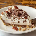 Delicious Chocolate Vanilla Cream Pie topped with rich cream