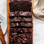 Slice of double chocolate banana bread with chocolate chips and bananas