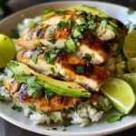 Honey Lime Chicken served on a bed of avocado rice with fresh toppings.